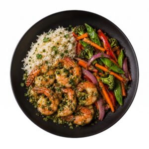 Crevettes sautées sauce ail rôtie & persil, riz jasmin et légumes croquants